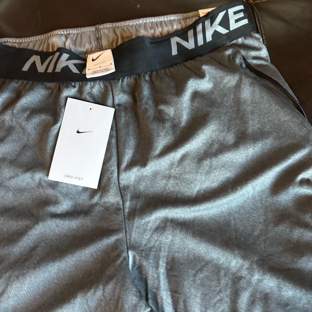 “Step up your style game with these sleek black Nike shorts from Gargies Vault!